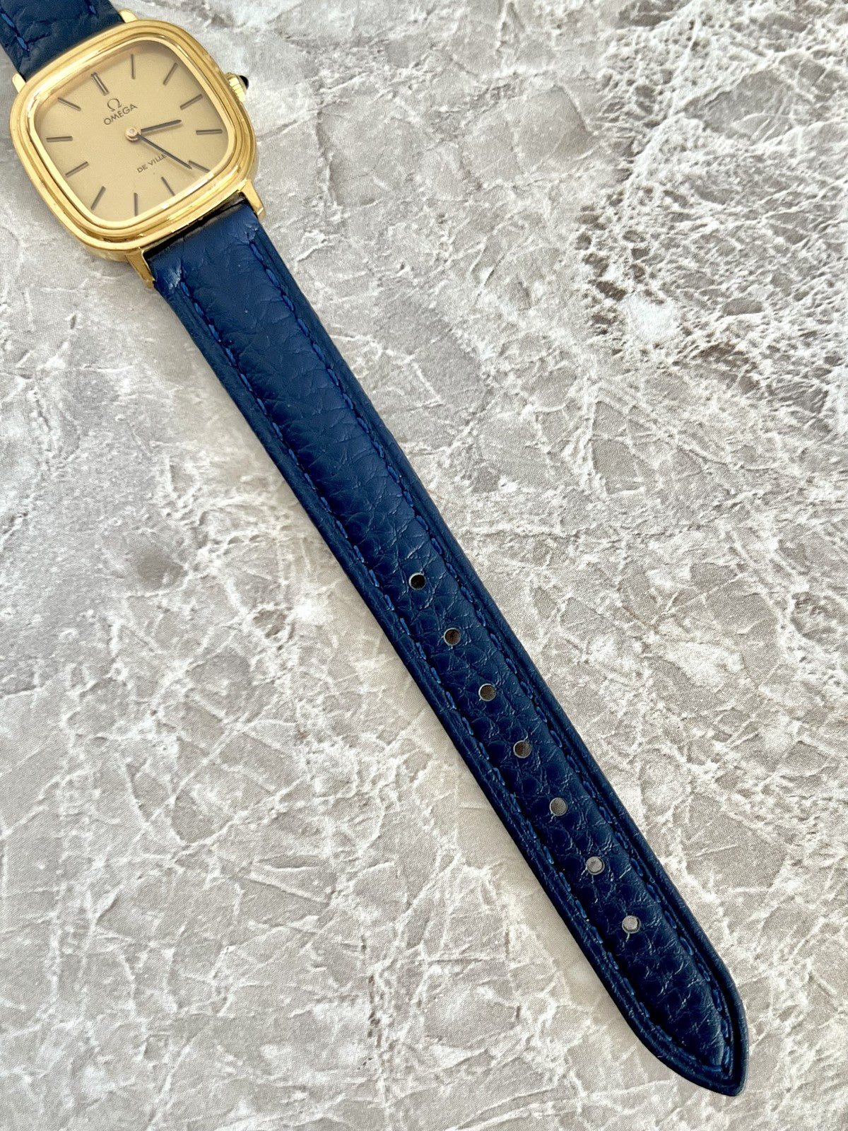 Omega De Ville navy blue textured watch strap with adjustable fit holes