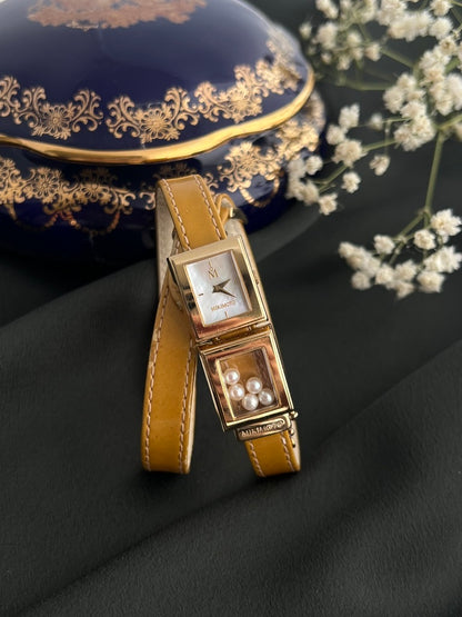 Front view of Mikimoto square mother-of-pearl dial watch with five loose pearls