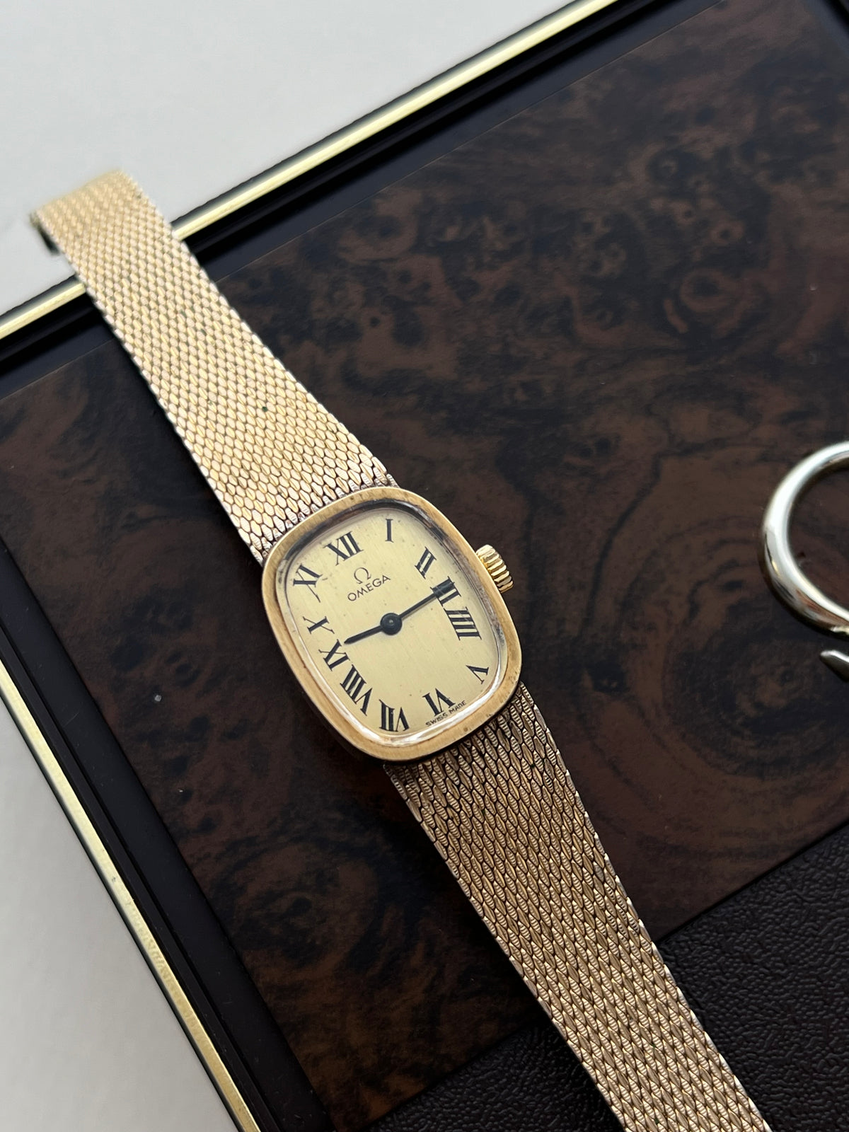Omega 14k Gold Filled Women's Watch with Roman Dial and Mesh Bracelet, dial close up of a vintage women's watch at Gilded Hour.