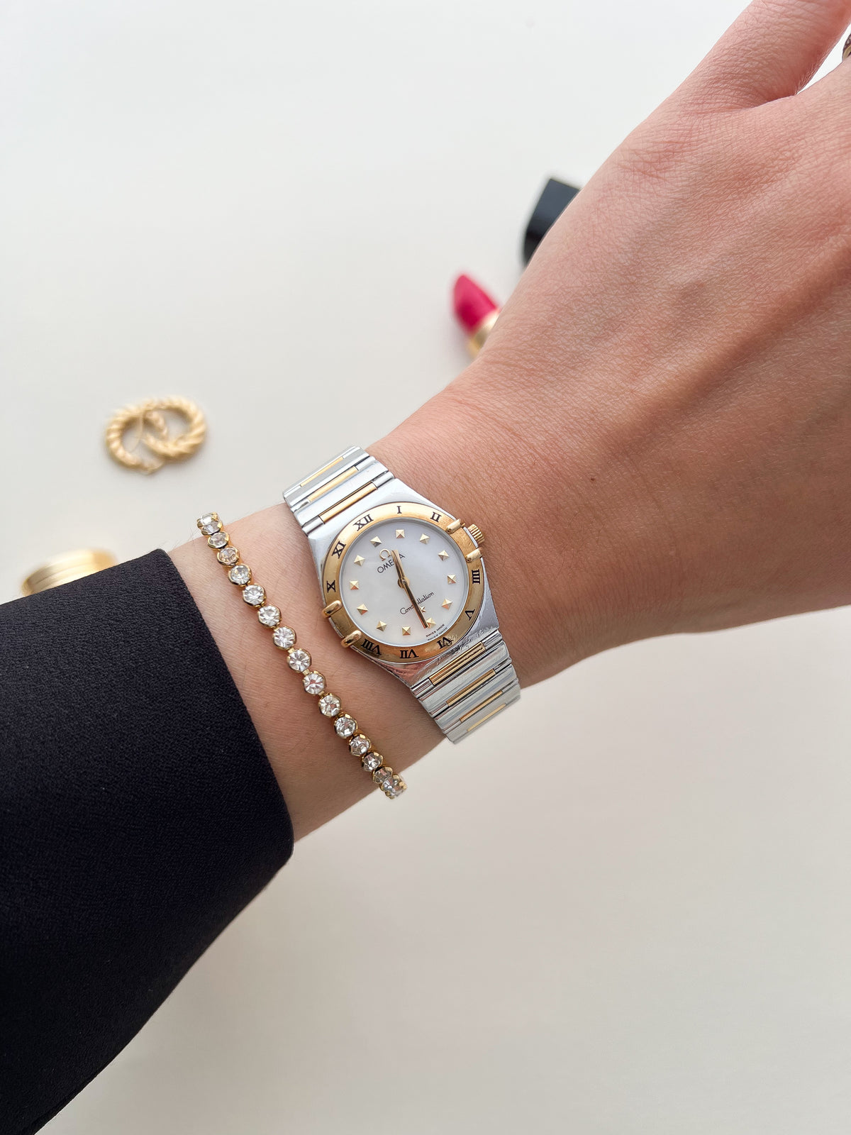 Two-tone Omega Constellation Manhattan watch worn on the wrist.