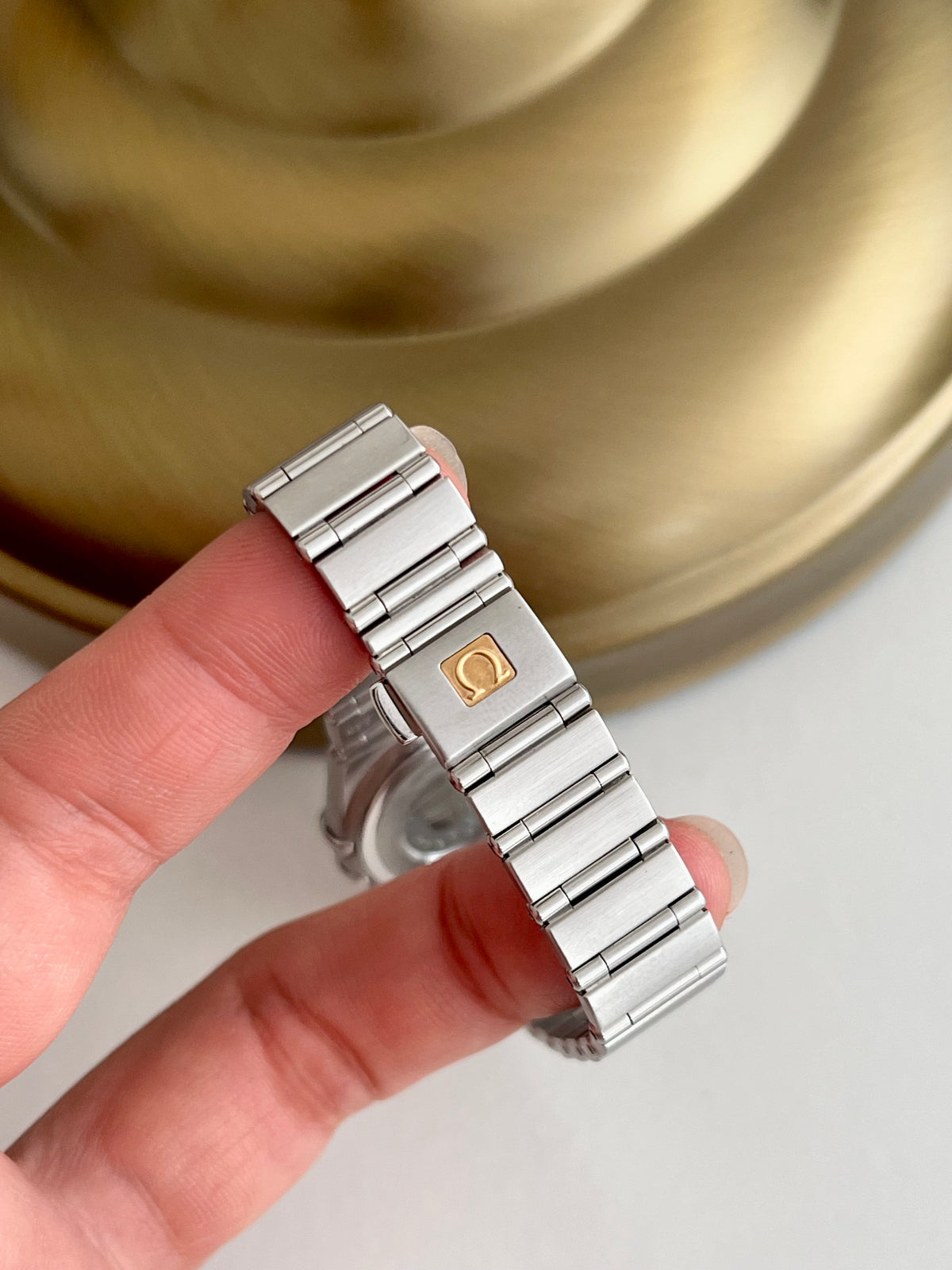 Omega Constellation Mini Guilloche Dial Women's Watch, dial close up of a vintage women's watch at Gilded Hour.