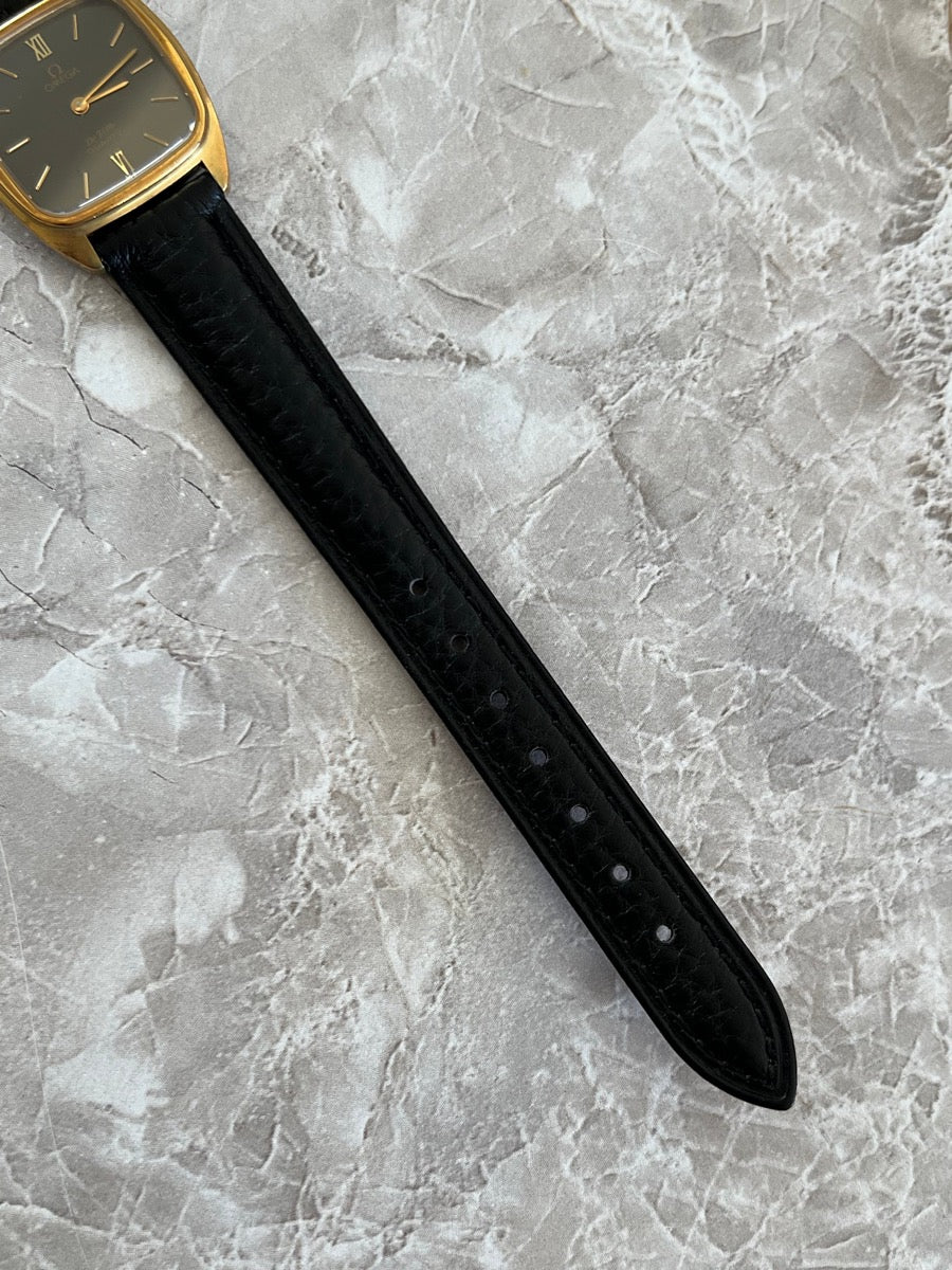 Close-up of black textured leather strap on Omega De Ville 591.0099