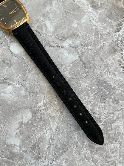 Close-up of black textured leather strap on Omega De Ville 591.0099