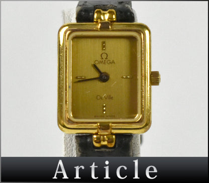 Front view of the Omega De Ville 591.0380 Calibre 1455 gold square watch with champagne dial and black leather strap