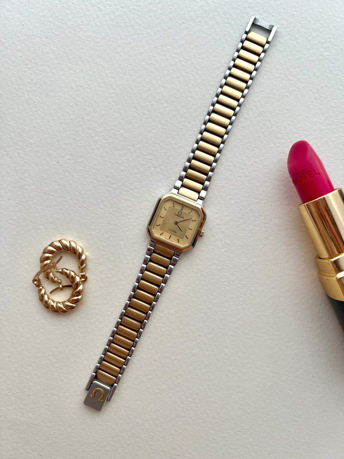 Front view of the Omega De Ville America square octagonal ladies watch with champagne dial.