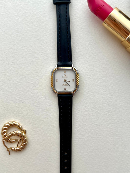 Close-up of the black aftermarket leather strap and Omega clasp.