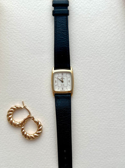 Omega De Ville watch with its original red presentation box.