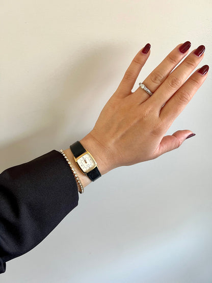 Front view of the Omega De Ville gold-tone rectangular ladies watch.