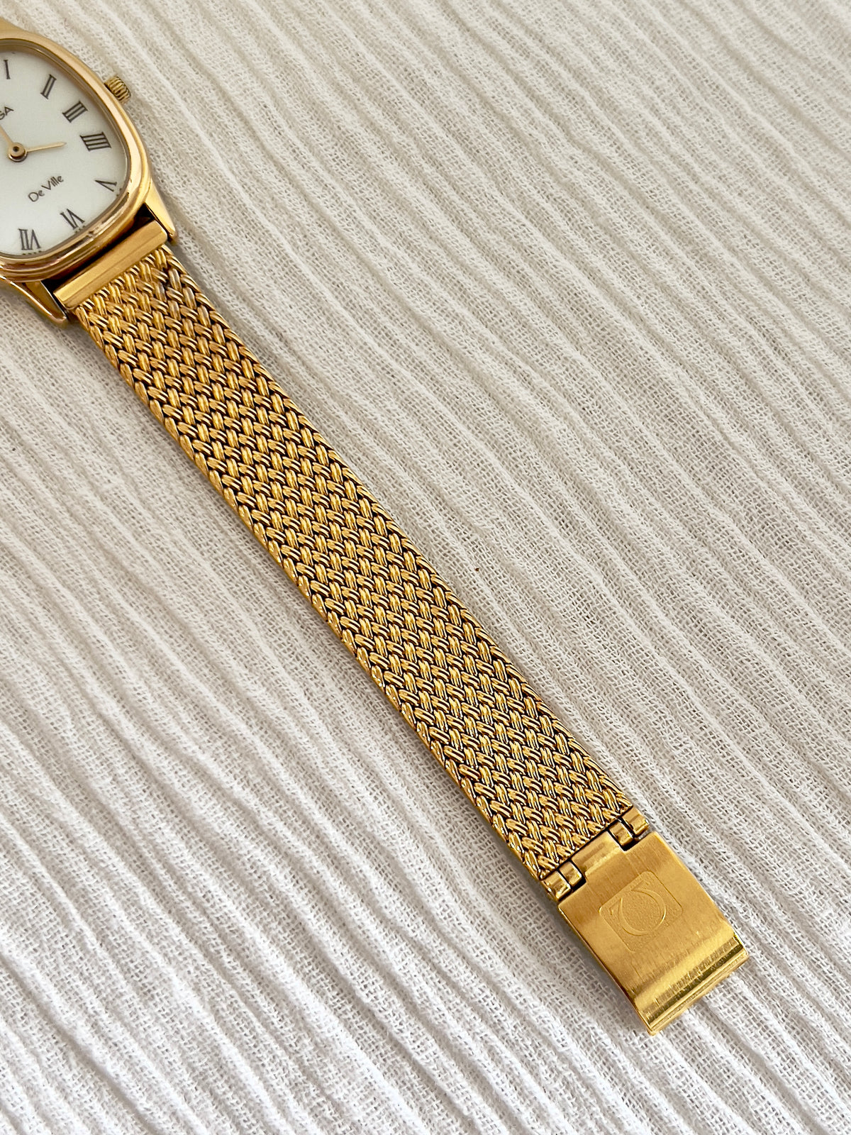 Caseback detail of the Omega De Ville gold watch.