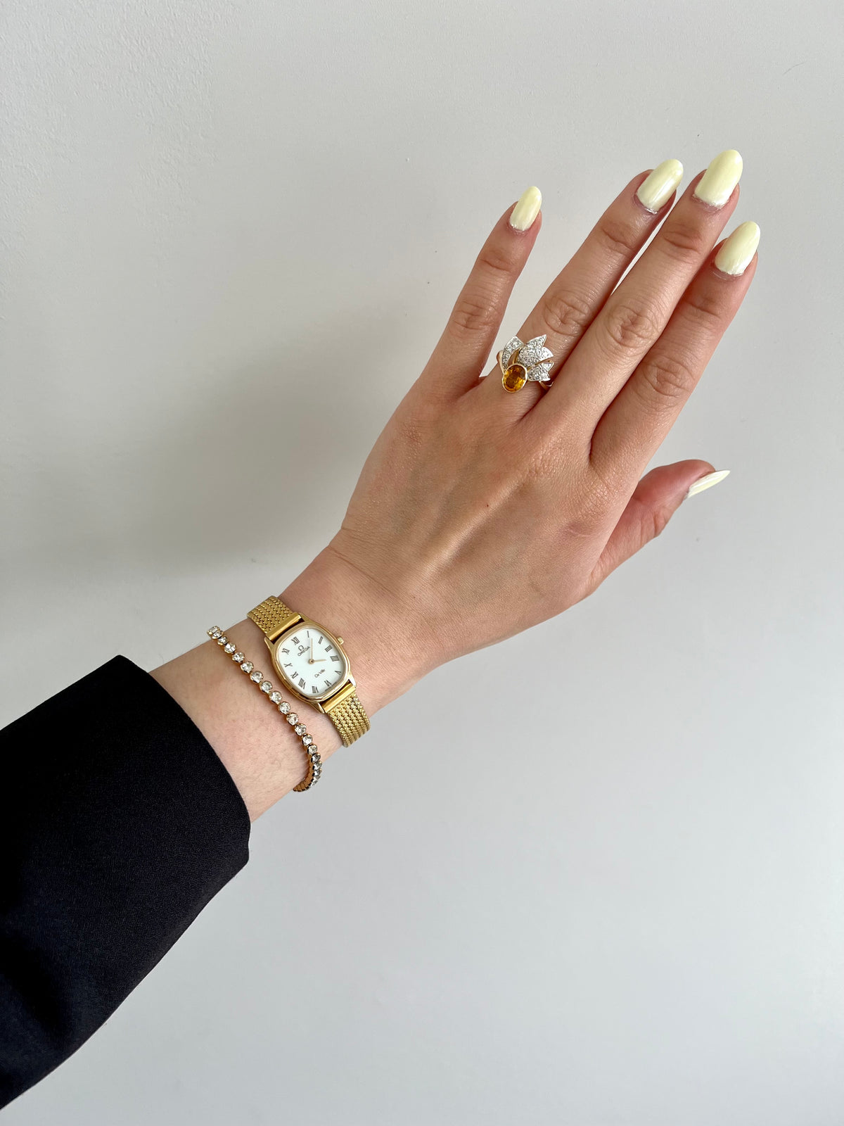 Front view of the Omega De Ville gold mesh bracelet watch.