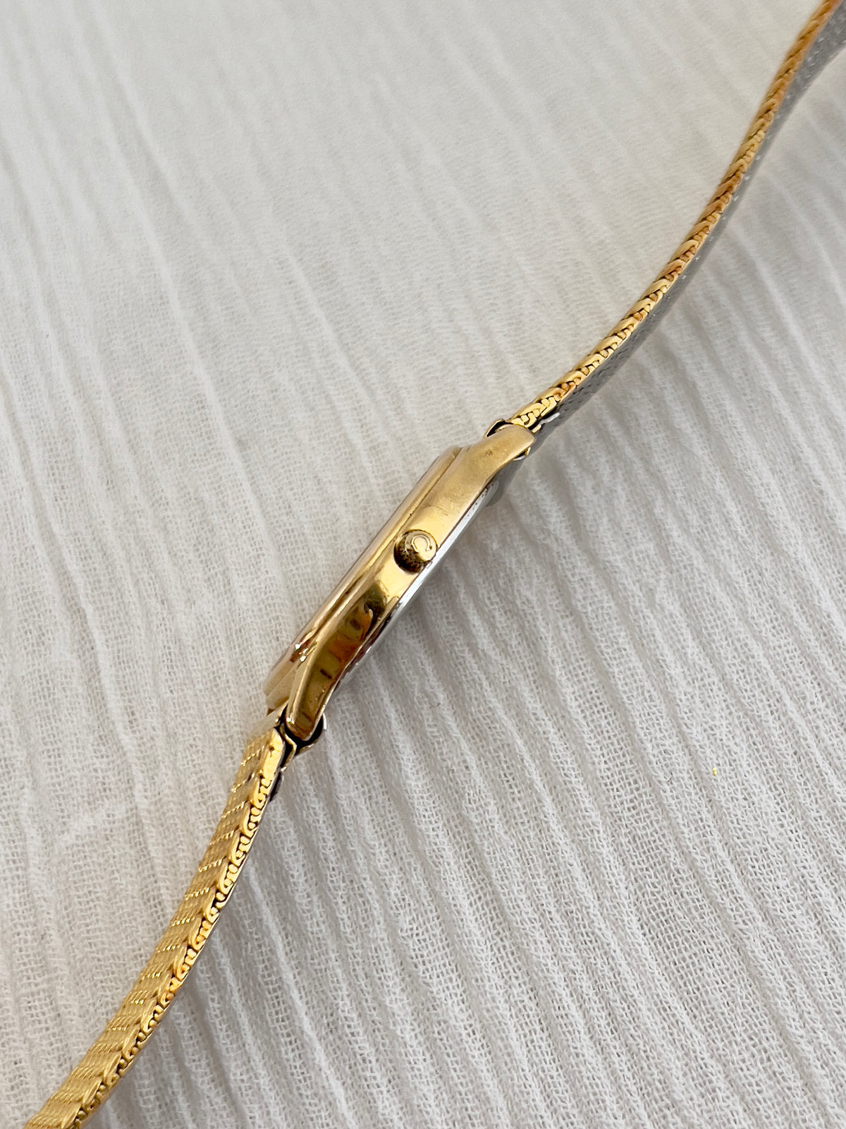Detail of the aftermarket mesh bracelet on the Omega De Ville watch.