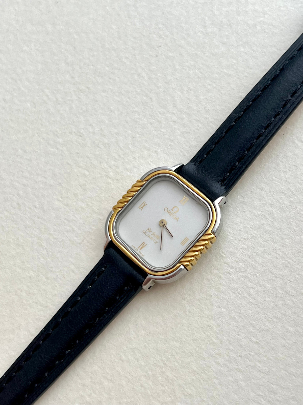 Caseback view of the vintage Omega De Ville cushion-case watch.