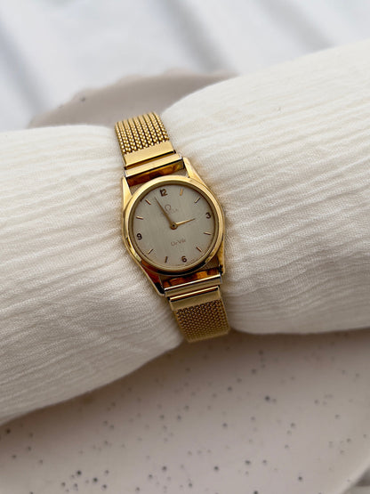 Vintage Omega De Ville ladies watch with round case and silvered dial.