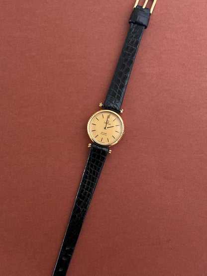 Detail of the Omega De Ville dial, hands and dotted case edge.