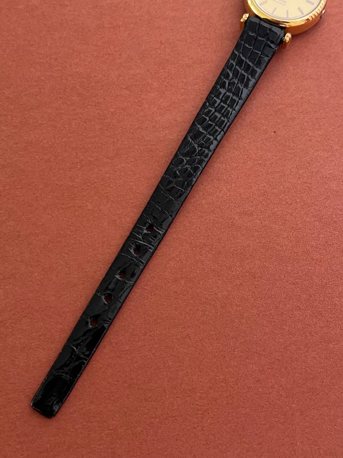 Second front view of the Omega De Ville round gold-tone case.