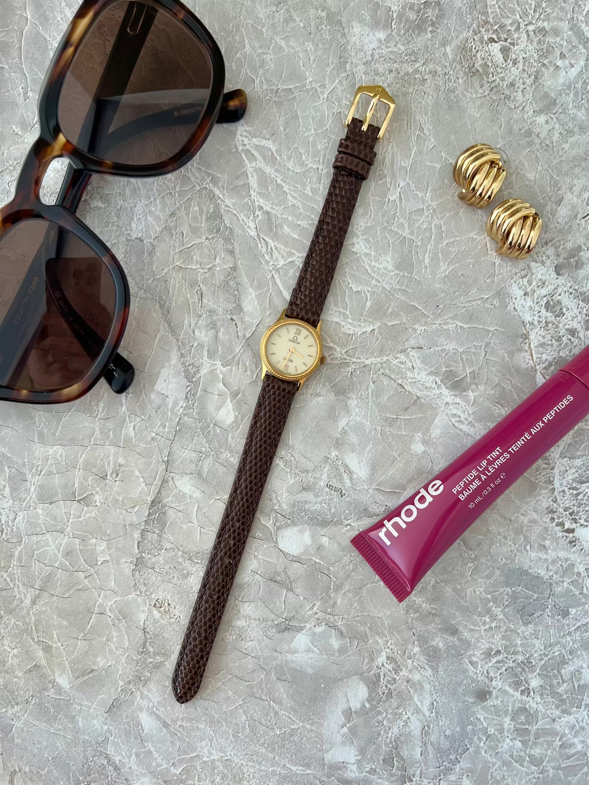 Omega De Ville Rope Bezel Brown Strap Watch: full watch beside separate accessories.