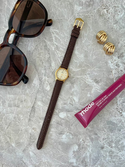 Omega De Ville Rope Bezel Brown Strap Watch: full watch beside separate accessories.