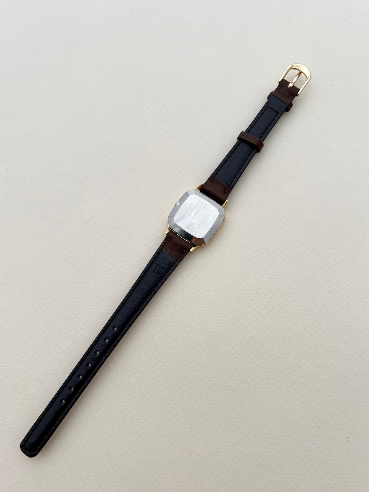 Omega De Ville Gold Toned Soft Octo Women’s Watch, caseback detail of a vintage women's watch at Gilded Hour.
