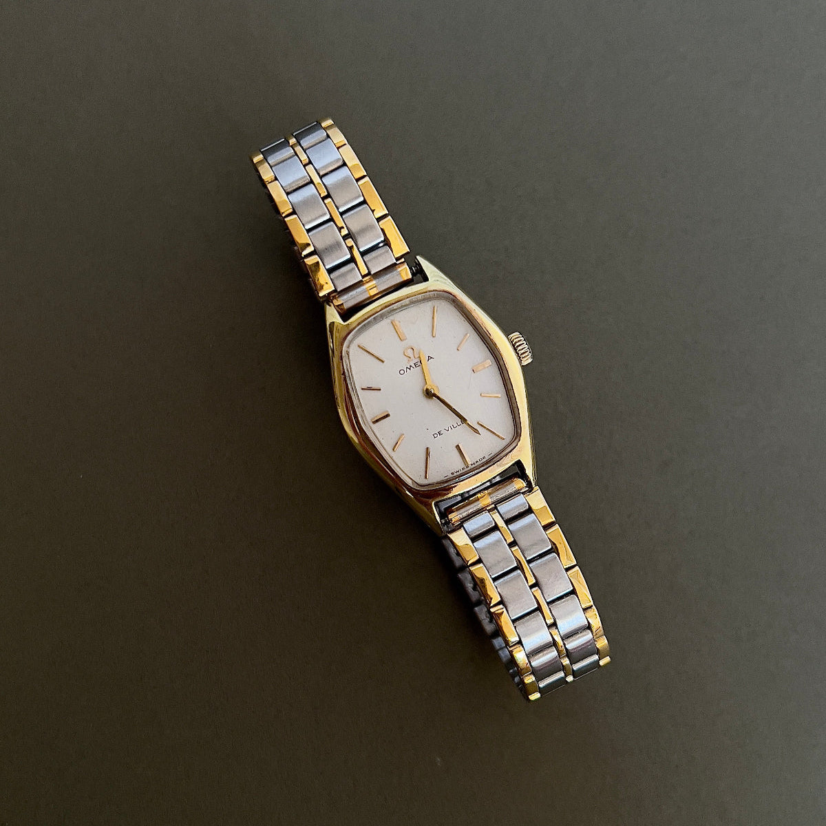 Omega De Ville Gold Woman's Watch with Tonneau Case, caseback detail of a vintage women's watch at Gilded Hour.