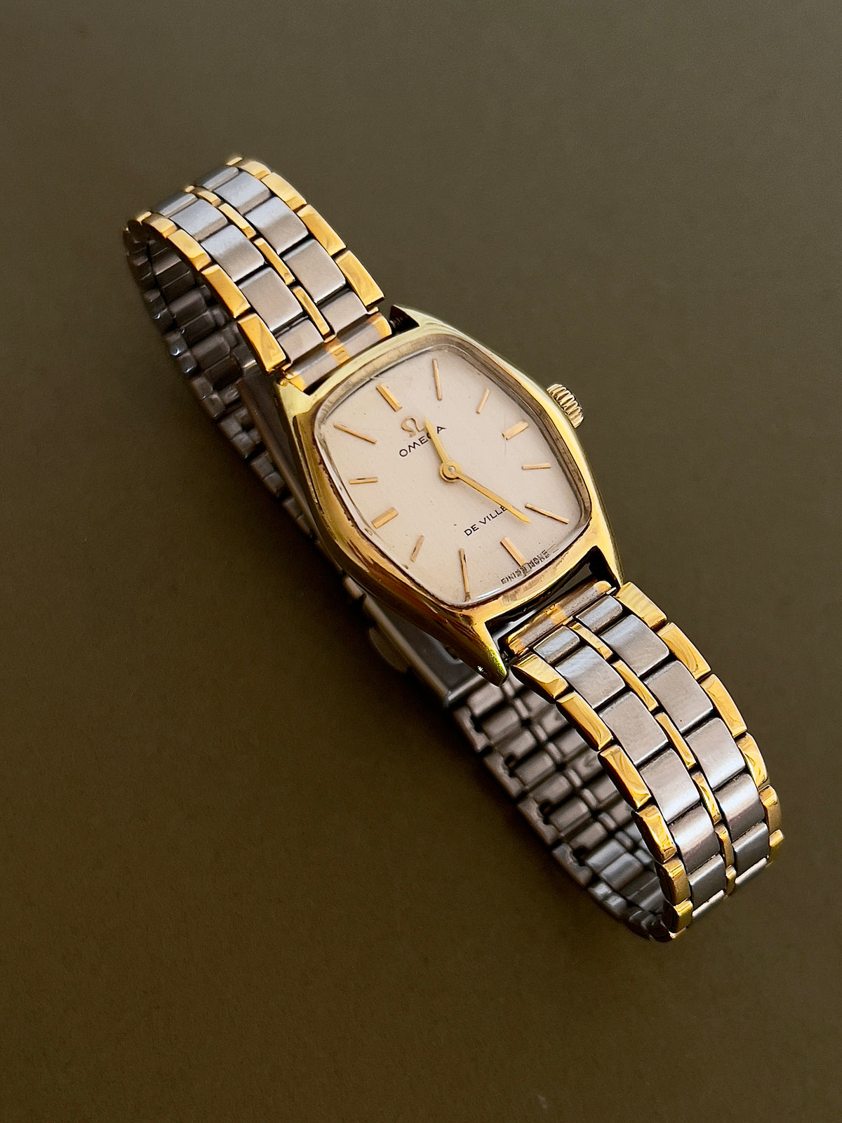 Omega De Ville Gold Woman's Watch with Tonneau Case, wrist shot of a vintage women's watch at Gilded Hour.