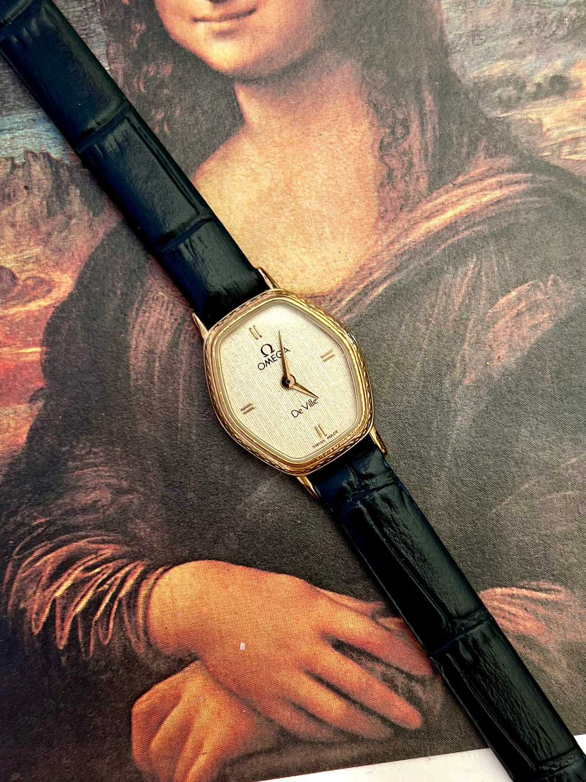 Omega De Ville gold tonneau ladies watch, wrist shot.