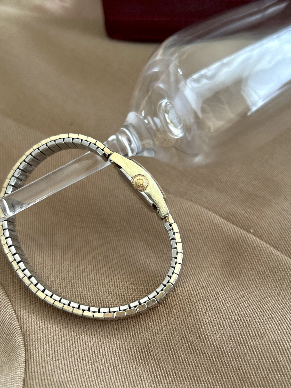 Side view of the Omega De Ville women’s watch showing the Omega signed crown and slim case