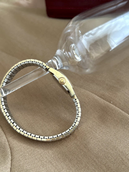 Side view of the Omega De Ville women’s watch showing the Omega signed crown and slim case