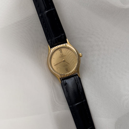 Omega De Ville Gold Woman's Watch with Unique Patterned Dial, front view of a vintage women's watch at Gilded Hour.