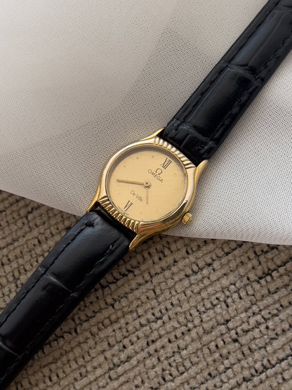 Omega De Ville Gold Woman's Watch with Unique Patterned Dial, wrist shot of a vintage women's watch at Gilded Hour.