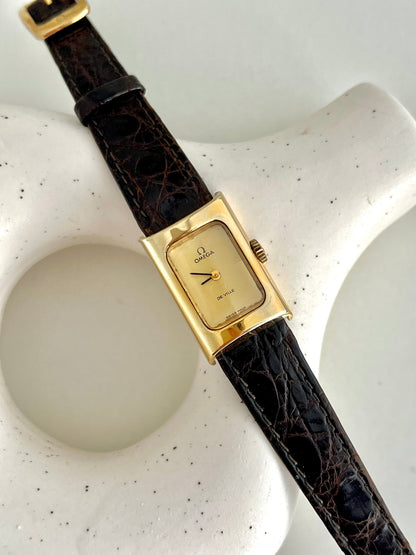 Close-up of the two-tone gold and champagne chequered dial on the Omega De Ville.