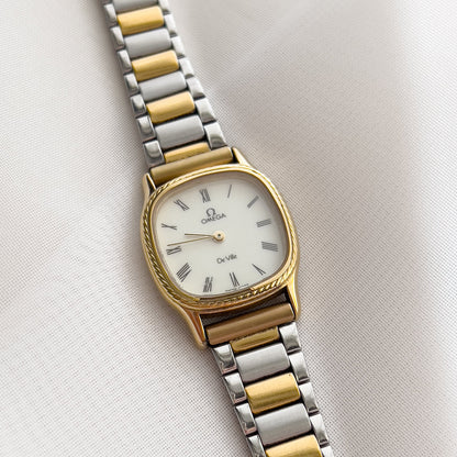 Omega De Ville Cushion Case Woman's Watch with Rope Bezel Pattern, angled view of a vintage women's watch at Gilded Hour.