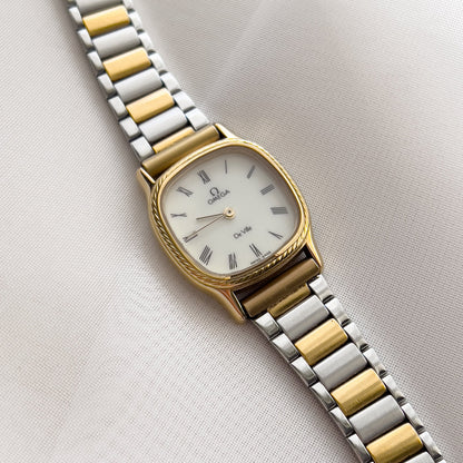 Omega De Ville Cushion Case Woman's Watch with Rope Bezel Pattern, wrist shot of a vintage women's watch at Gilded Hour.