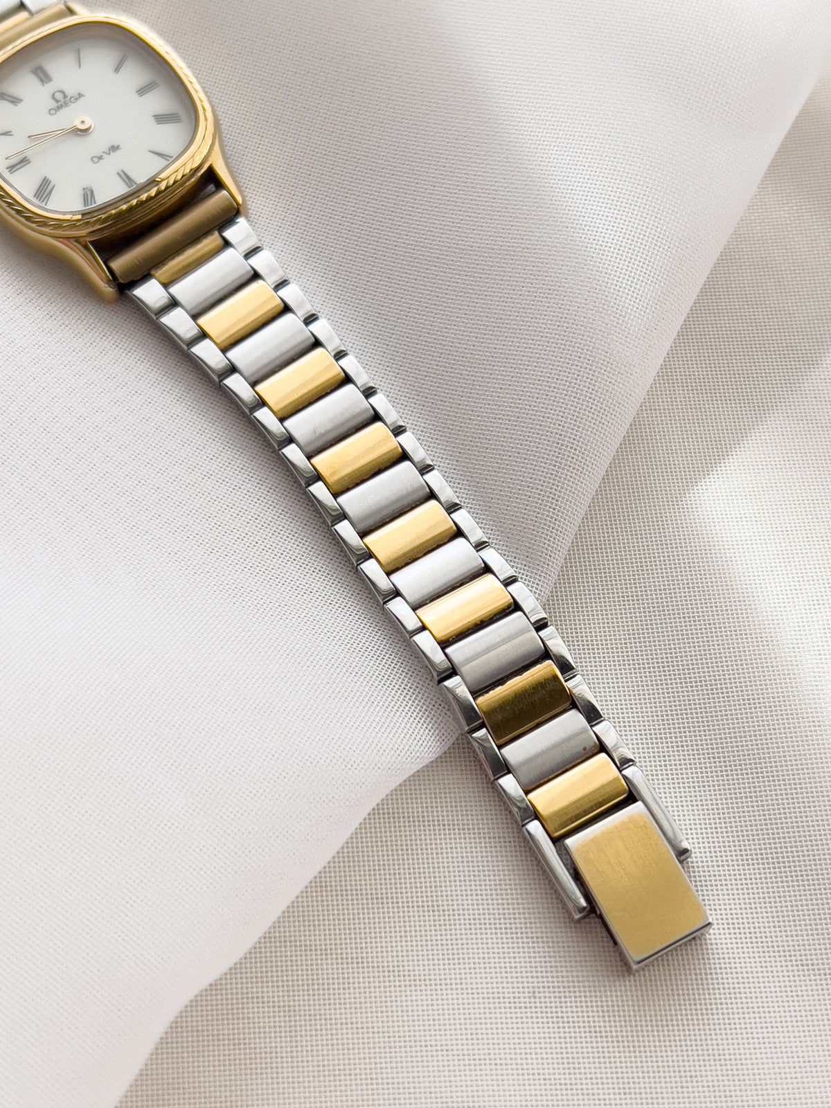 Omega De Ville Cushion Case Woman's Watch with Rope Bezel Pattern, caseback detail of a vintage women's watch at Gilded Hour.
