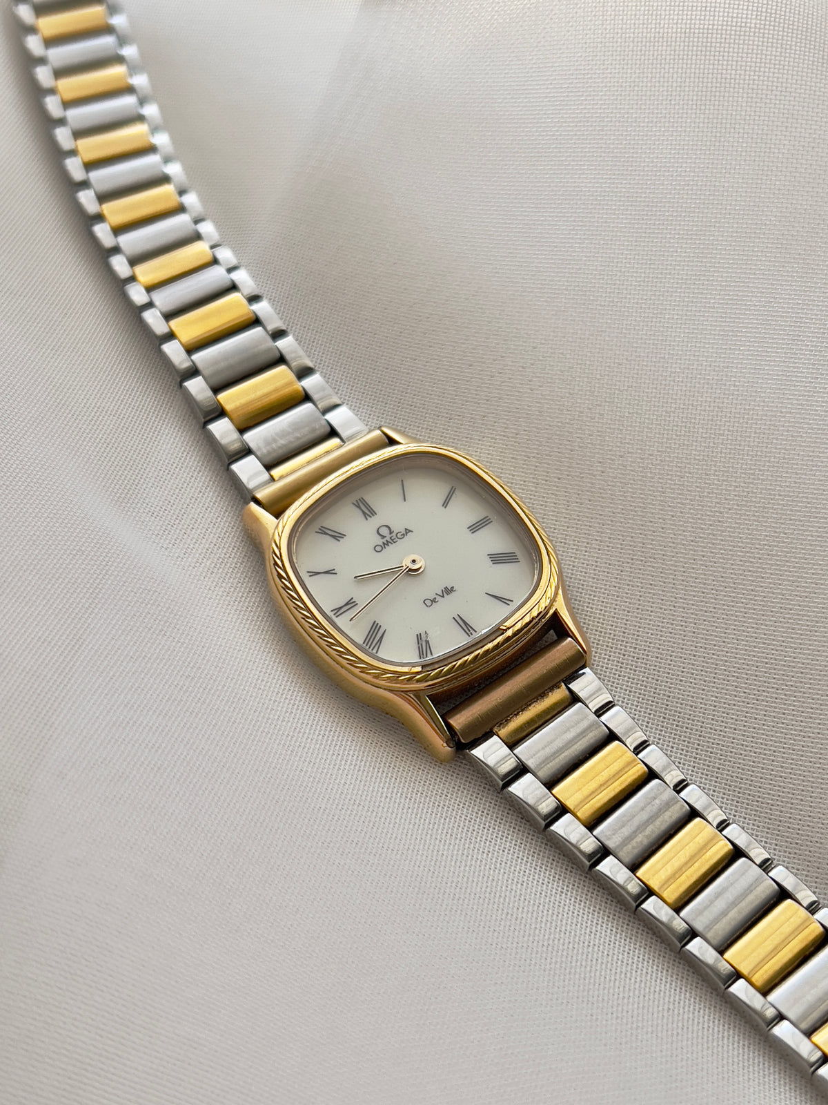 Omega De Ville Cushion Case Woman's Watch with Rope Bezel Pattern, dial close up of a vintage women's watch at Gilded Hour.