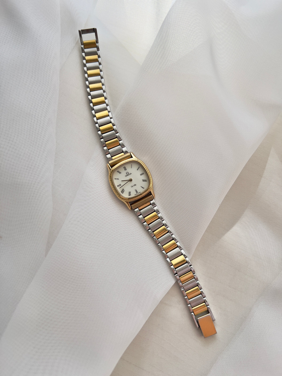 Omega De Ville Cushion Case Woman's Watch with Rope Bezel Pattern, wrist shot of a vintage women's watch at Gilded Hour.