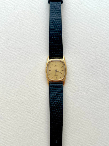 Side profile of the Omega De Ville cushion watch case.