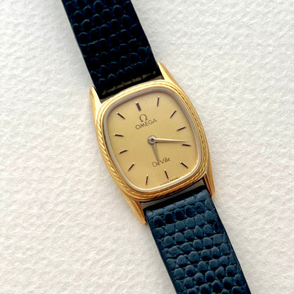 Caseback of the Omega De Ville gold-tone cushion watch with rope bezel.