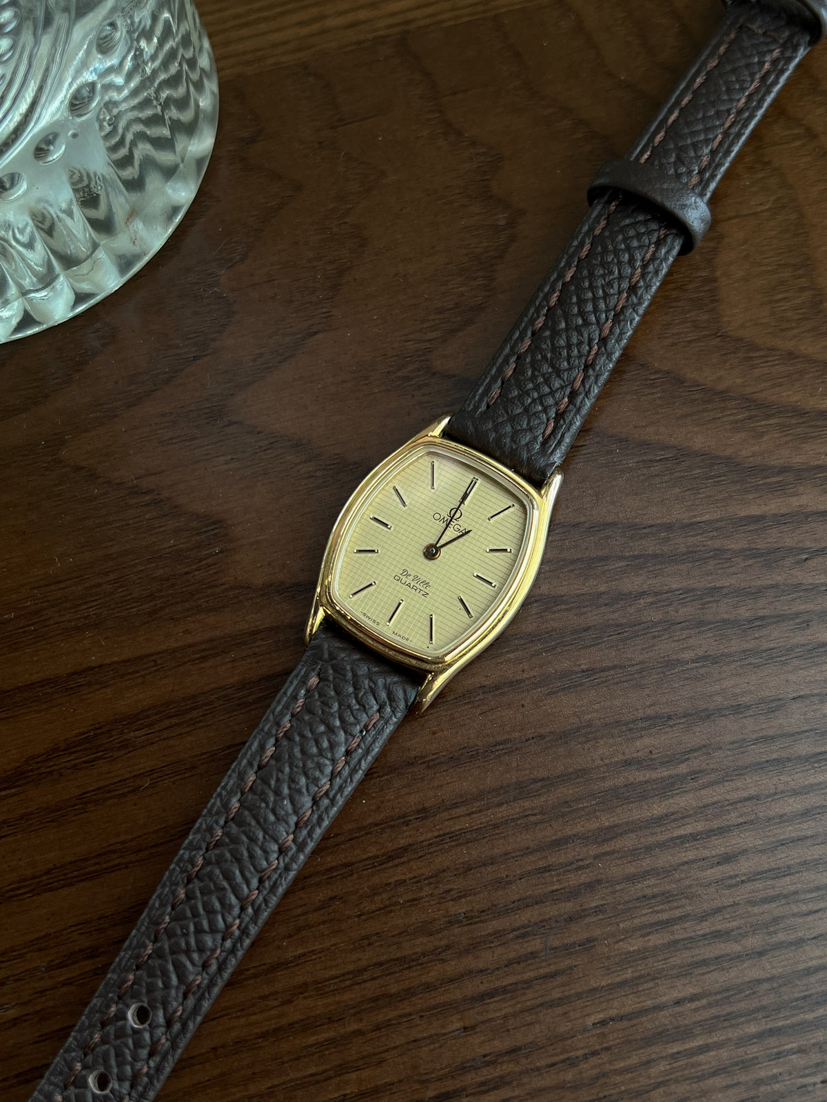 Omega De Ville tonneau grid dial women’s watch, wrist shot.