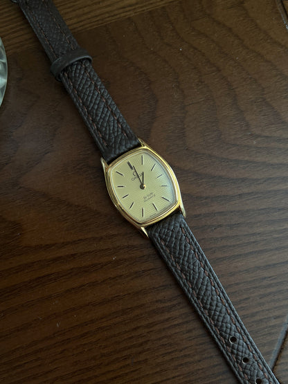 Omega De Ville tonneau grid dial women’s watch, caseback detail.