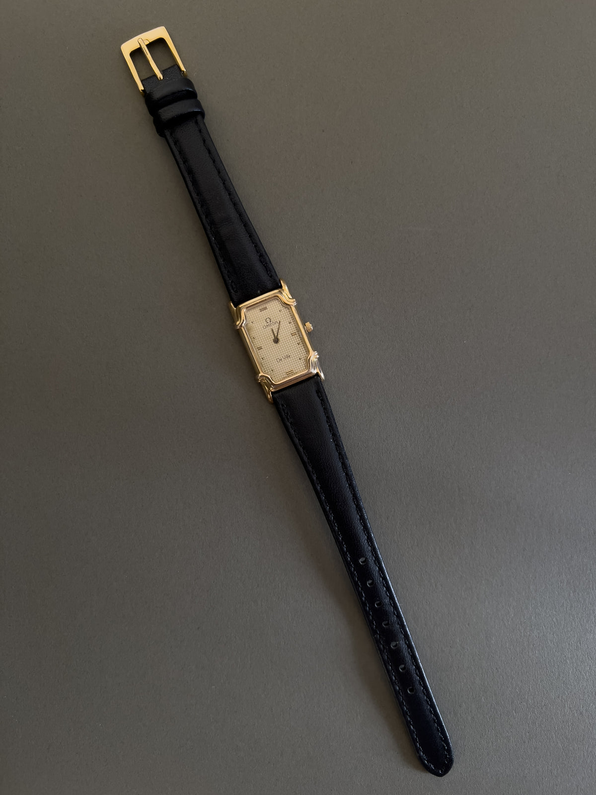 Omega De Ville Ladies Rectangular Gold-Plated Watch with Guilloché Dial, front view of a vintage women's watch at Gilded Hour.
