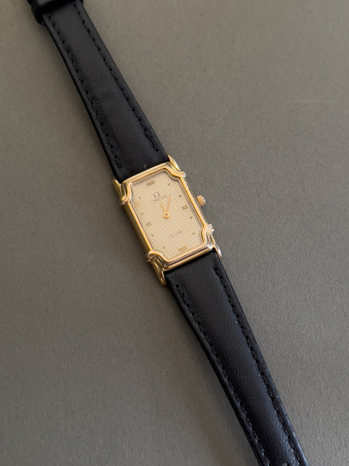 Omega De Ville Ladies Rectangular Gold-Plated Watch with Guilloché Dial, dial close up of a vintage women's watch at Gilded Hour.