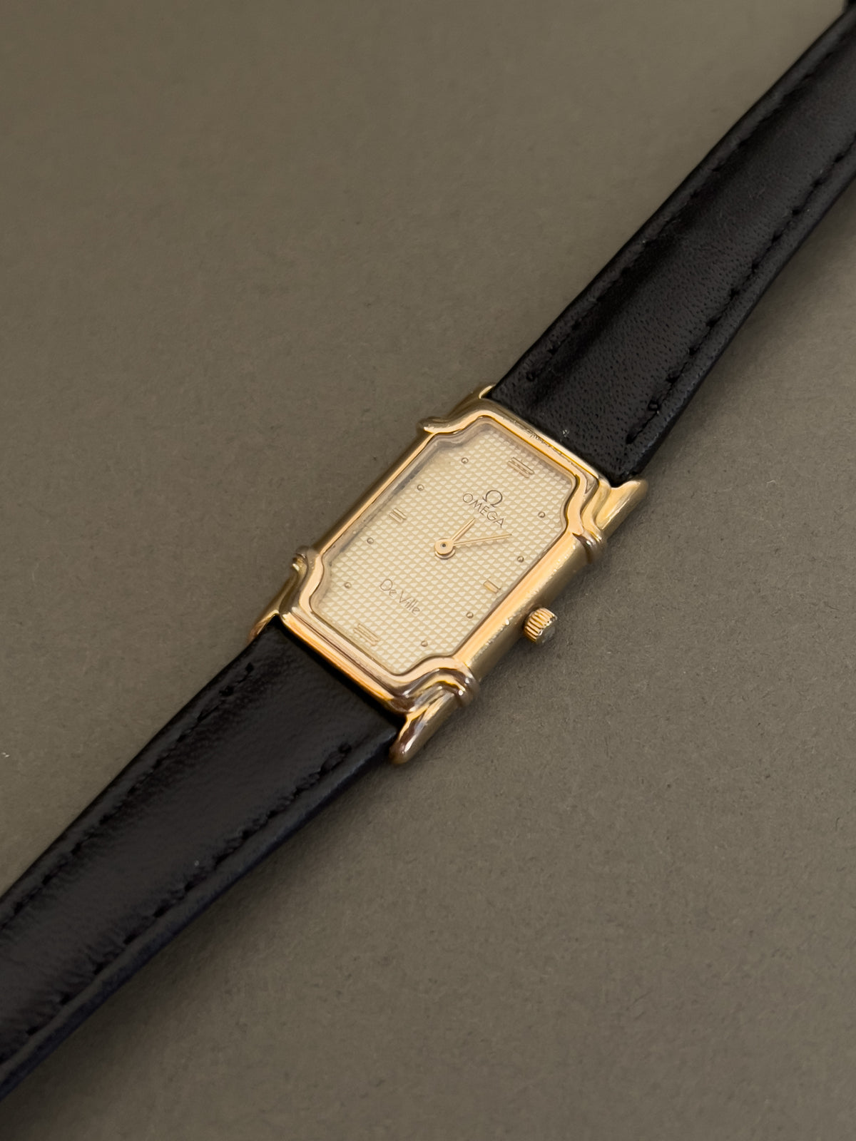 Omega De Ville Ladies Rectangular Gold-Plated Watch with Guilloché Dial, wrist shot of a vintage women's watch at Gilded Hour.