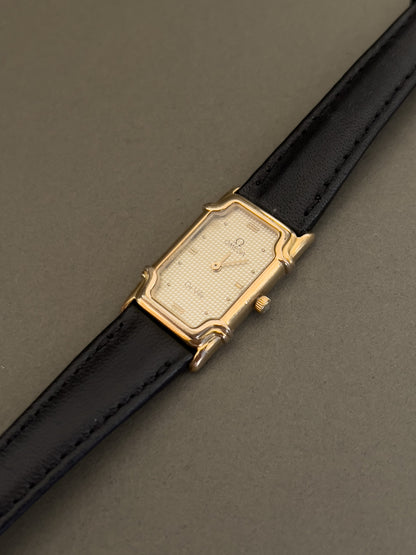 Omega De Ville Ladies Rectangular Gold-Plated Watch with Guilloché Dial, wrist shot of a vintage women's watch at Gilded Hour.