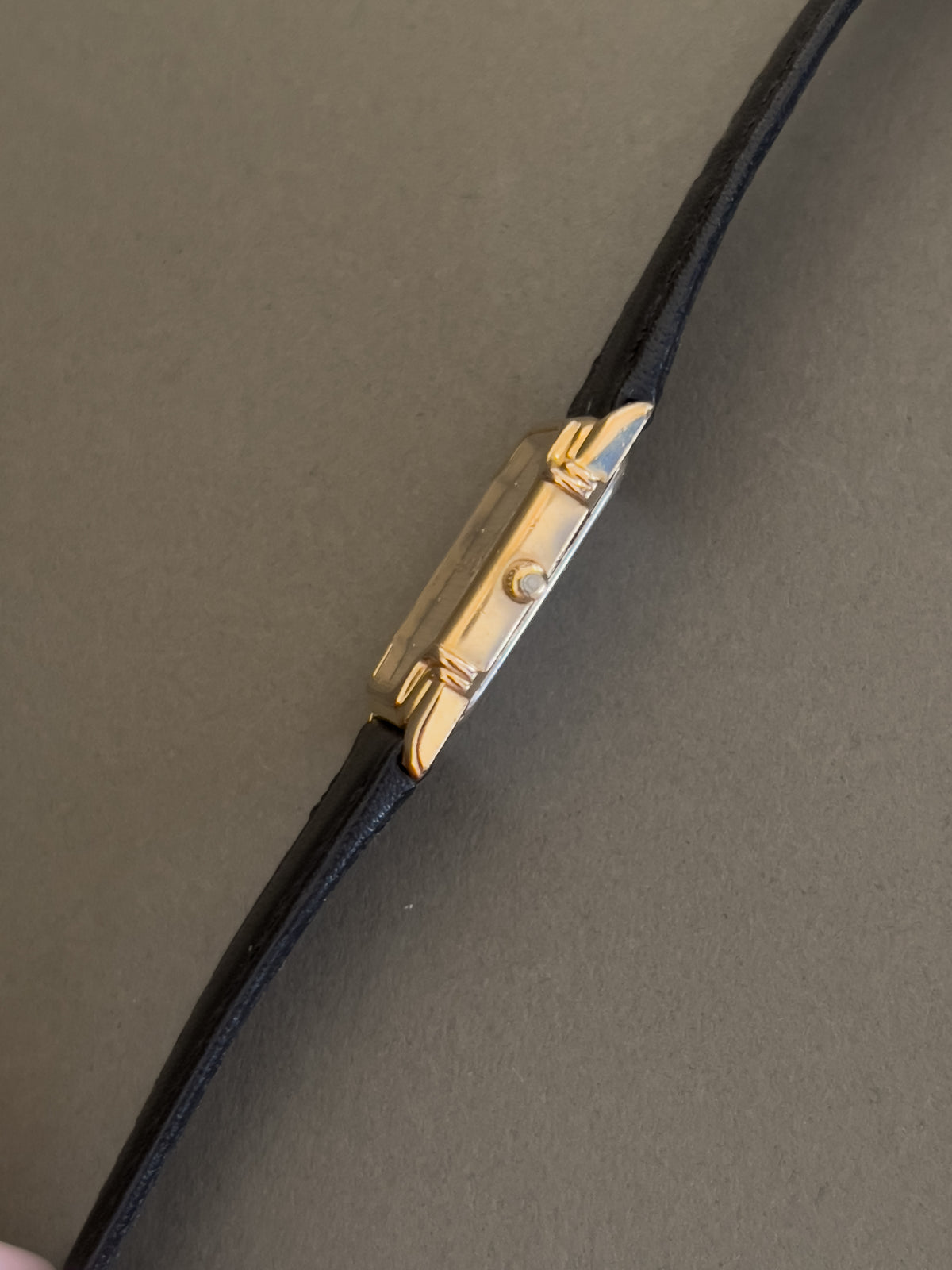 Omega De Ville Ladies Rectangular Gold-Plated Watch with Guilloché Dial, case profile of a vintage women's watch at Gilded Hour.