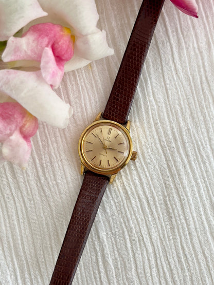 Angled view of the Omega Geneve gold automatic watch.