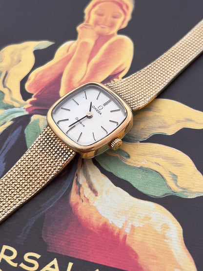 Omega Geneve gold mesh bracelet watch with presentation box.