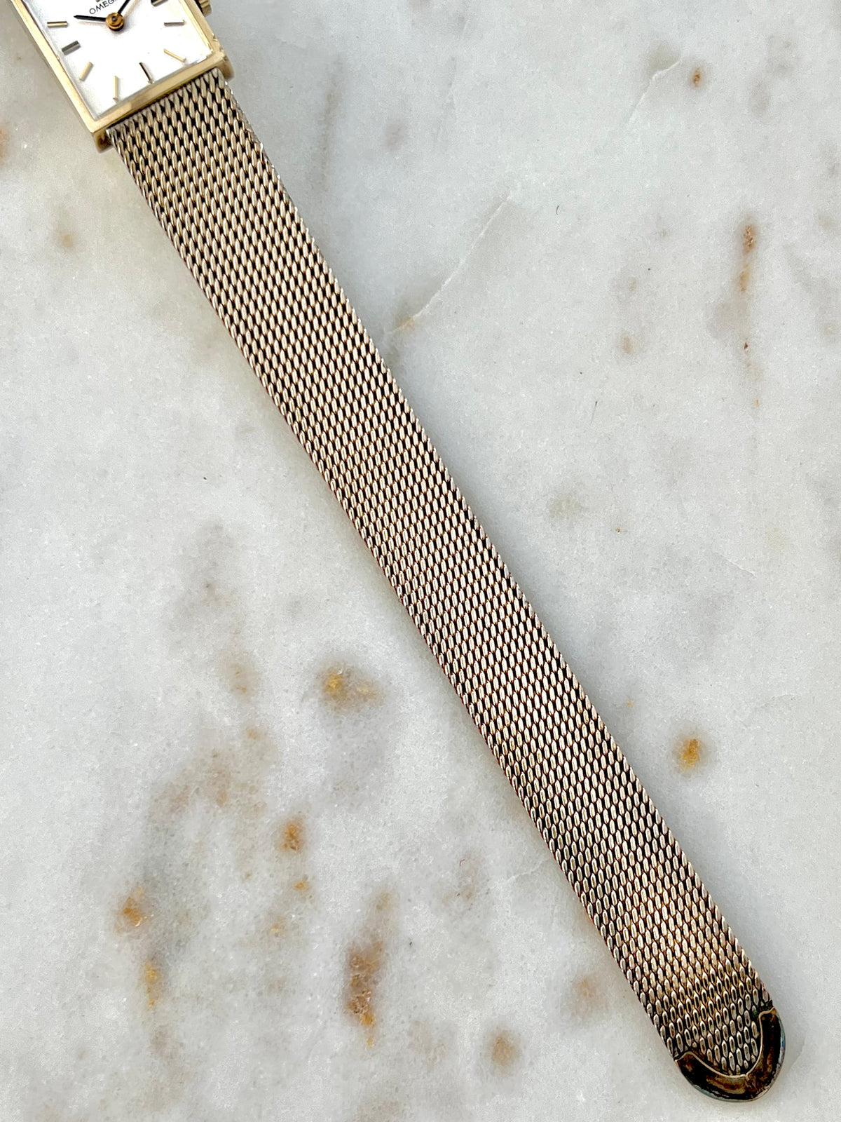 Omega Rectangular 14k Gold Filled Mesh Bracelet Watch, bracelet detail of a vintage women's watch at Gilded Hour.
