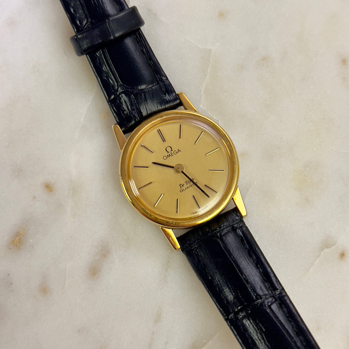 Omega Round Gold Toned Woman's Watch, dial close up of a vintage women's watch at Gilded Hour.