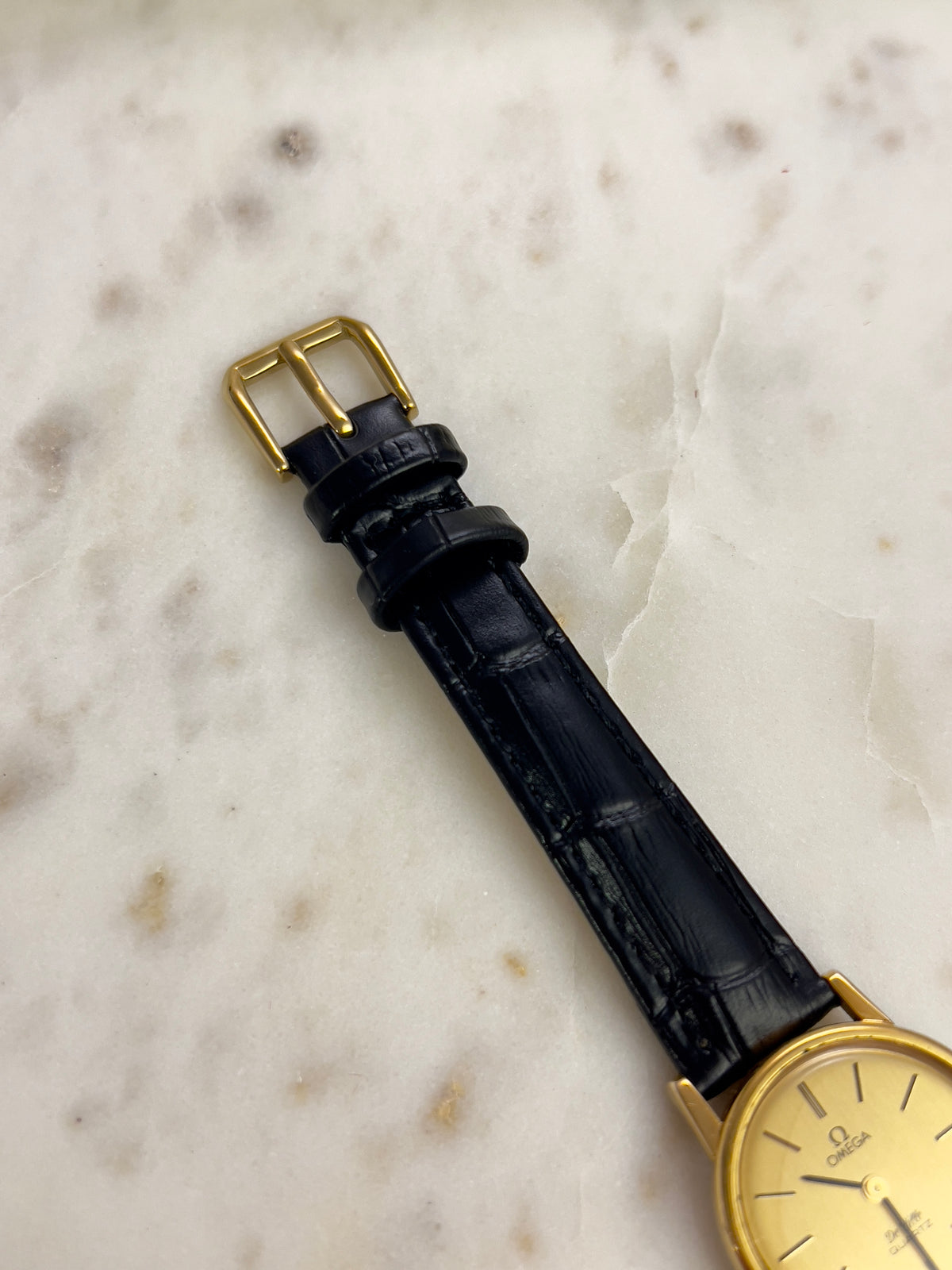 Omega Round Gold Toned Woman's Watch, dial close up of a vintage women's watch at Gilded Hour.