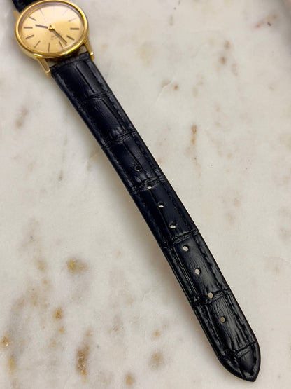 Omega Round Gold Toned Woman's Watch, angled view of a vintage women's watch at Gilded Hour.
